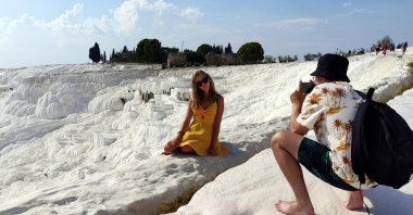 A woman poses for the camera in Pamukkale, Denizli, western Turkey, Sept. 19, 2021. (DHA Photo)