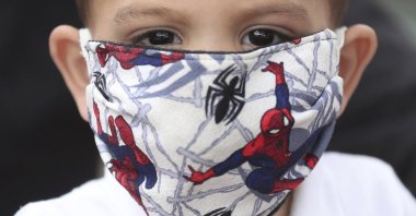 A boy wears a Spider-man face mask amid the spread of the coronavirus in Bogota, Colombia, April 30, 2020. (AP Photo)