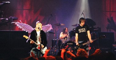 Kurt Cobain (L), Dave Grohl (C) and Krist Novoselic of Nirvana perform on stage at Pier 48 in Seattle, U.S., Dec. 13, 1993. (Getty Images)