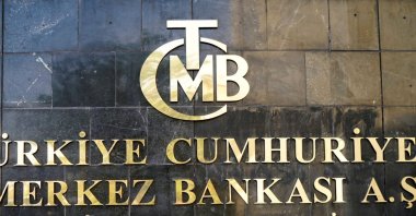 A logo of the Central Bank of the Republic of Turkey (CBRT) is pictured at the entrance of the bank's headquarters in the capital Ankara, Turkey, April 19, 2015. (Reuters Photo)