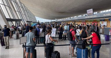Passengers are seen at Dulles Washington International Airport (IAD) in Dulles, Virginia, U.S., Aug. 14, 2021. (AFP Photo)