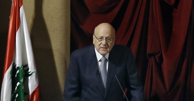 Lebanese Prime Minister Najib Mikati speaks during a parliament session to confirm Lebanon's new government at a Beirut theater known as the UNESCO palace, Lebanon, Monday, Sept. 20, 2021. (AP Photo)