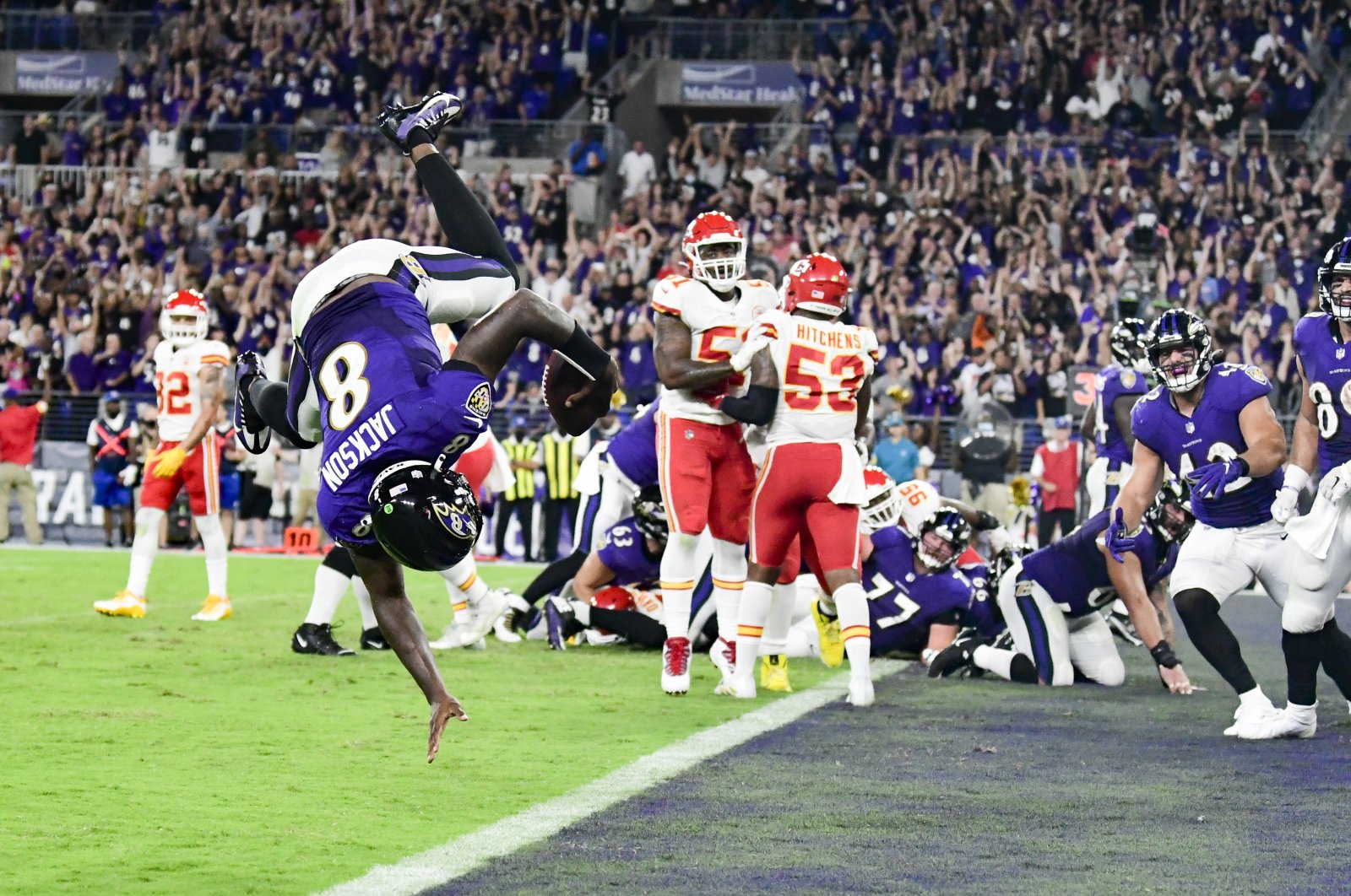 Baltimore Ravens quarterback Lamar Jackson (8) flips into the end zone for a fourth-quarter touchdown against the Kansas City Chiefs at M&T Bank Stadium, Baltimore, Maryland, U.S., Sept. 19, 2021. (Tommy Gilligan-USA TODAY Sports via REUTERS)