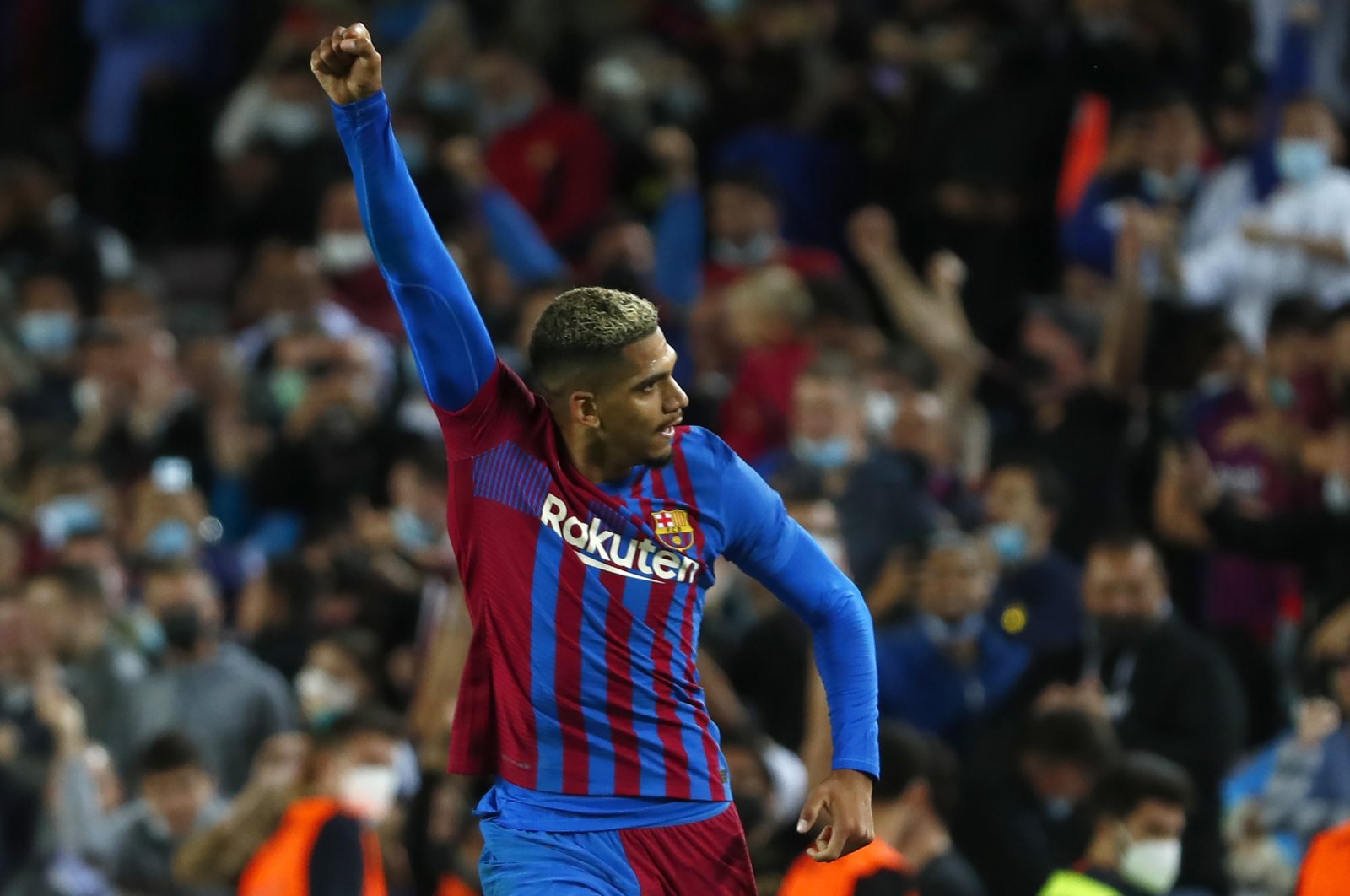 Barcelona's Ronald Araujo celebrates after scoring his side's first goal during the Spanish La Liga soccer match between Barcelona and Granada, at the Camp Nou stadium in Barcelona, Spain, Monday, Sept. 20, 2021. (AP Photo)