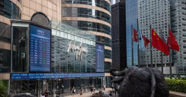 Pedestrians walk past Exchange Square, the building housing the stock exchange, in Hong Kong, China, Sept. 21, 2021. (EPA Photo)