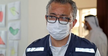 WHO chief Tedros Adhanom Ghebreyesus (C) visits the Park View Villas, a Qatar's 2022 FIFA World Cup residence in Doha, housing Afghan evacuees, on Sept. 19, 2021. (AFP Photo)