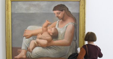 A visitor examines "Mother and Child" by Pablo Picasso in the Musee Picasso, Paris, France. (DPA Photo)