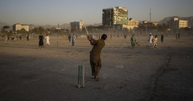 Afghans play cricket at the Chaman-e-Hozari Park in Kabul, Afghanistan, Sept. 17, 2021. (AP Photo)