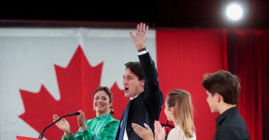 Canada's Liberal Prime Minister Justin Trudeau, accompanied by his wife Sophie Gregoire and their children Ella-Grace and Xavier waves to supporters during the Liberal election night party in Montreal, Quebec, Canada, Sept. 21, 2021. (REUTERS)
