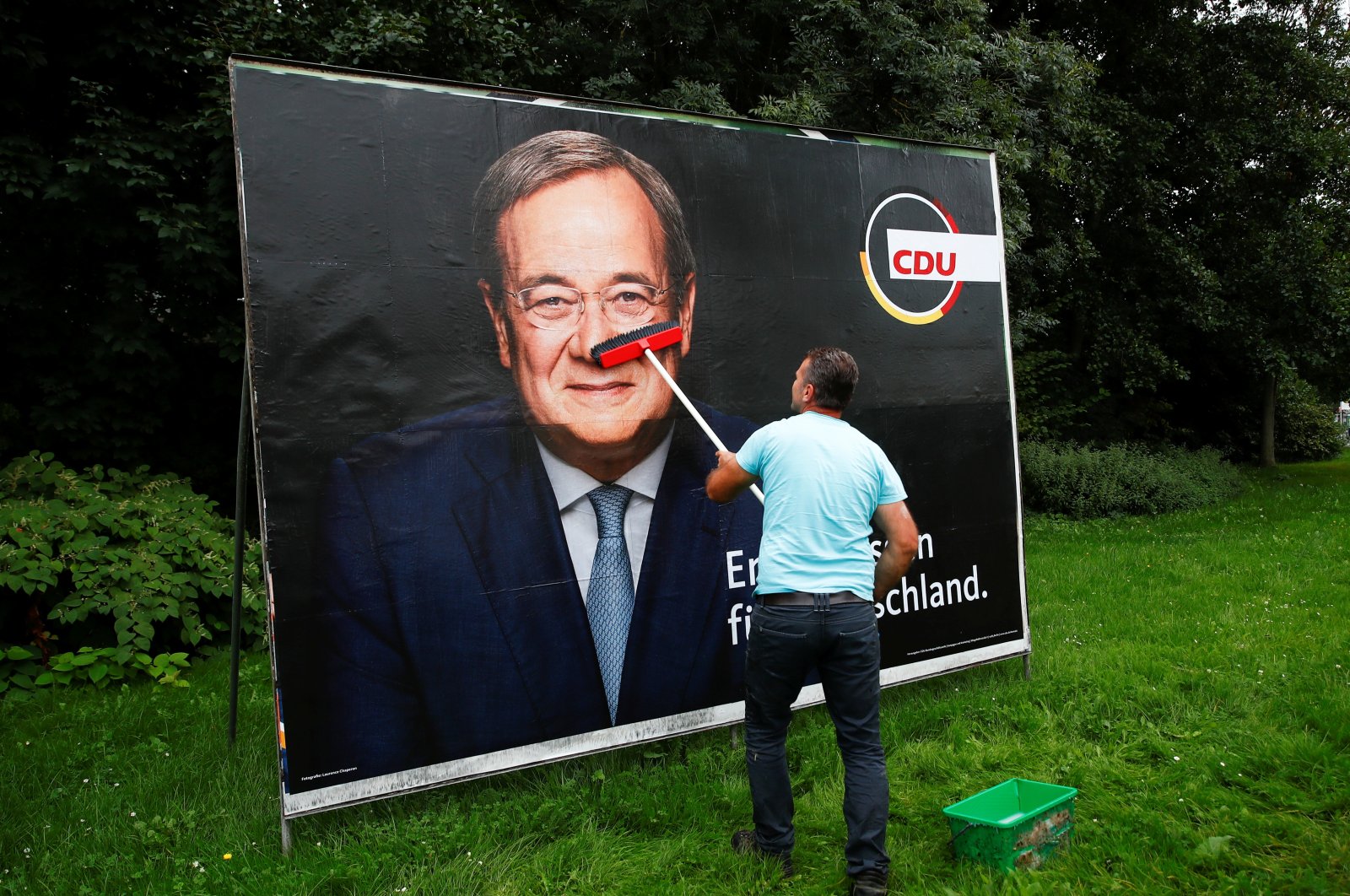 A placard of Armin Laschet, the Christian Democratic Union's (CDU) candidate for chancellor, is placed on a board for the Sept. 26 German general elections in Bonn, Germany, Sept. 20, 2021. (Reuters Photo)