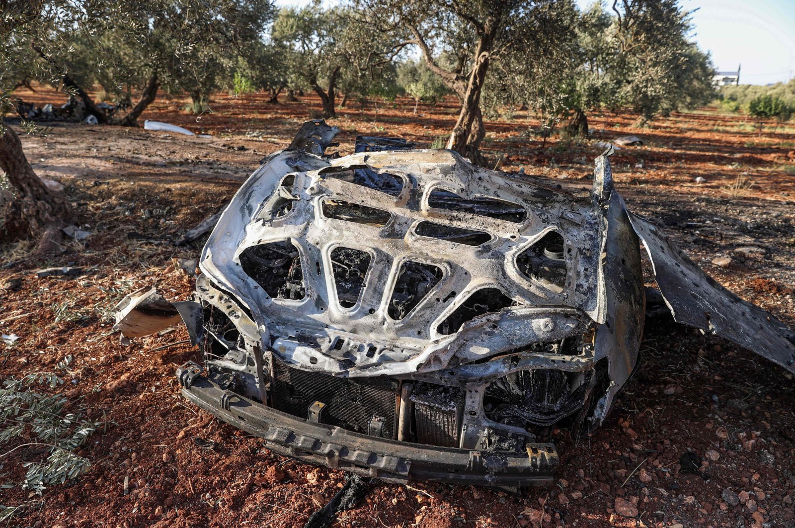 A view of the vehicle destroyed by what is believed to be a drone strike, on the northeastern outskirts of Idlib, Syria, Sept. 20, 2021. (AFP Photo)