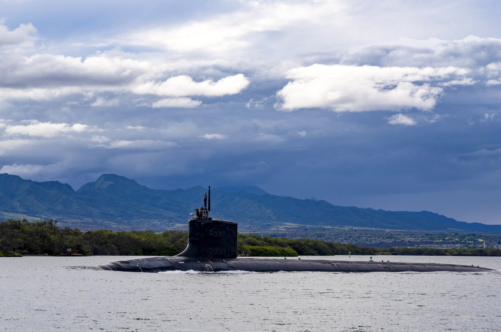 The Virginia-class fast-attack submarine USS Missouri (SSN 780) departs Joint Base Pearl Harbor-Hickam for a scheduled deployment in the 7th Fleet area of responsibility, Sept. 1, 2021. (U.S. Navy via AP)