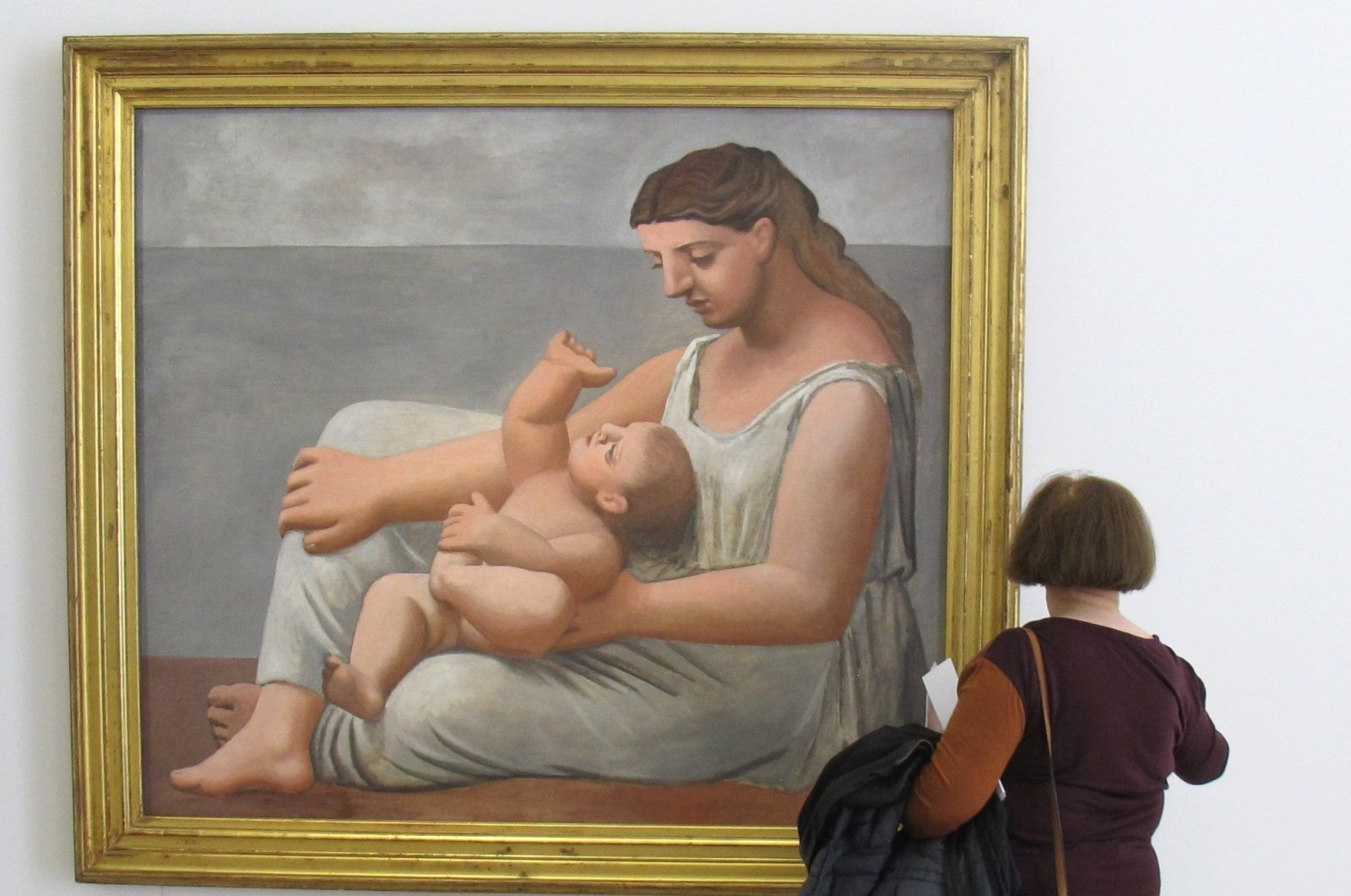 A visitor examines "Mother and Child" by Pablo Picasso in the Musee Picasso, Paris, France. (DPA Photo)