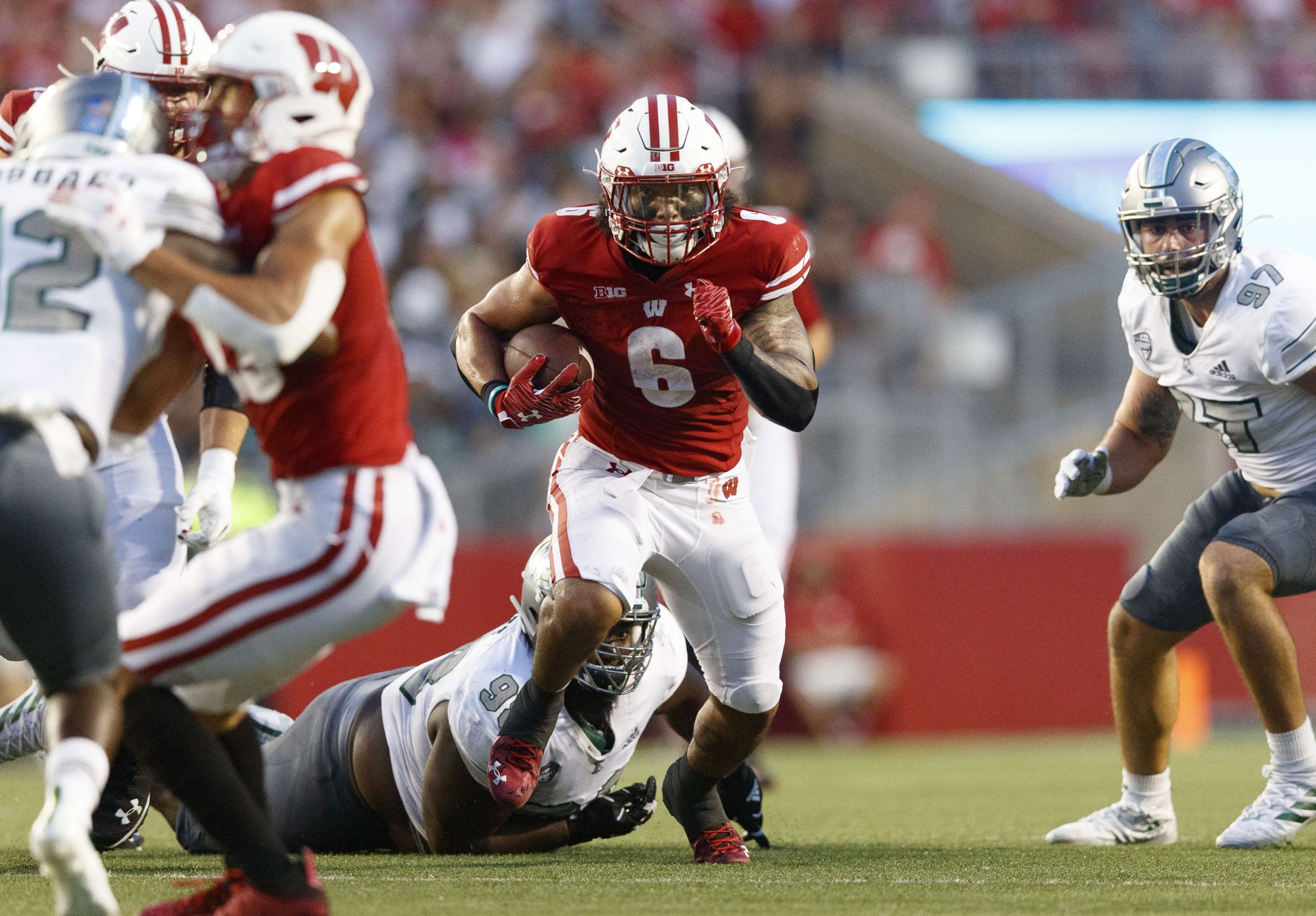 Wisconsin Badgers running back Chez Mellusi (6) rushes with the football during the second quarter against the Eastern Michigan Eagles at Camp Randall Stadium, Madison, Wisconsin, U.S., Sept. 11, 2021. (Jeff Hanisch-USA TODAY Sports via REUTERS)