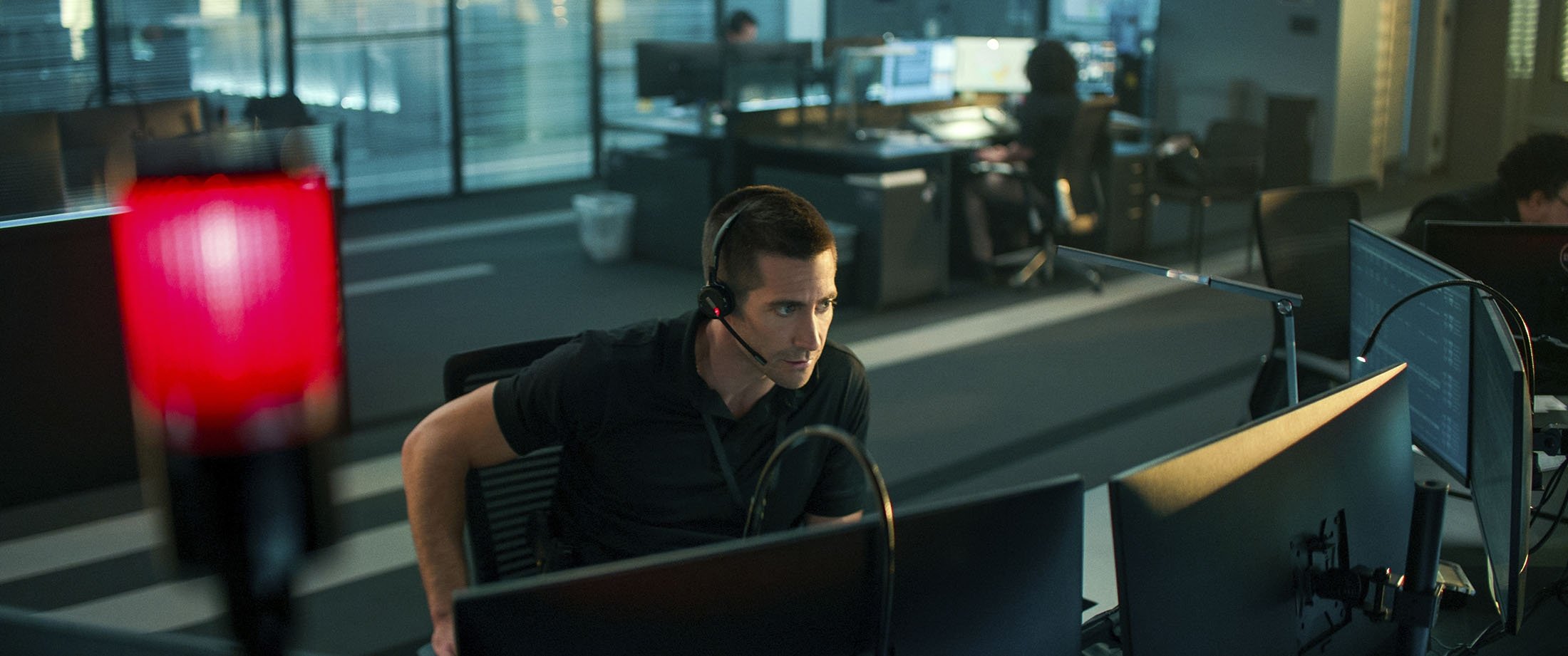 Jake Gyllenhaal, in a scene from the film "The Guilty." (Netflix via AP)