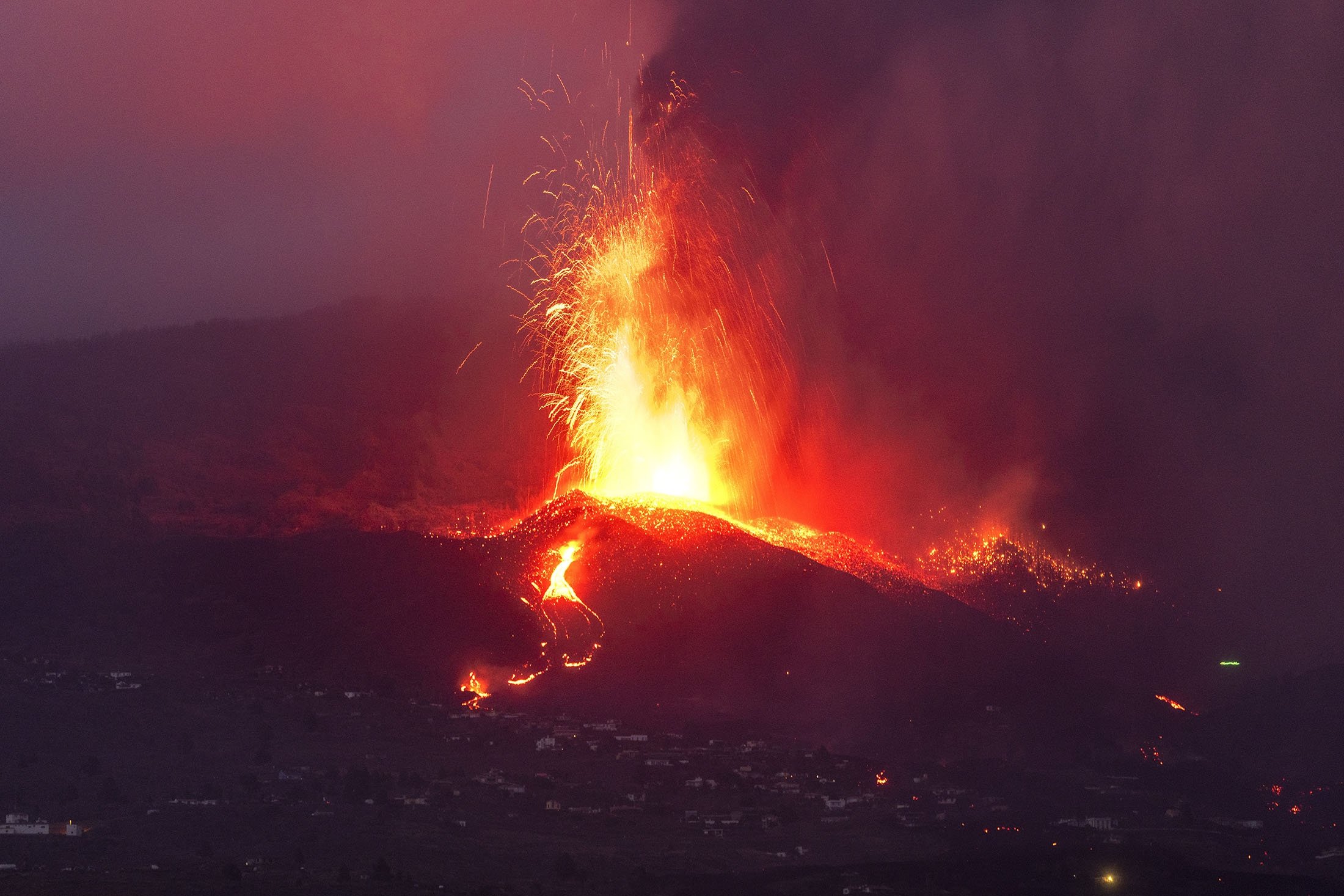 Lava from a volcano eruption flows on the island of La Palma in the Canaries, Spain, Sept. 21, 2021. (AP Photo)