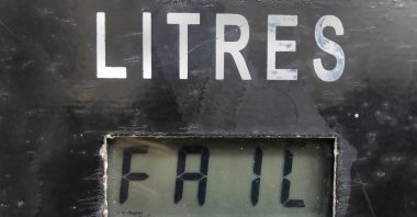 A screen on a gasoline pump reads, "Fail," after the latest increase in fuel prices with most meters unable to accommodate the new five digit price for one liter of gas, in Beirut, Lebanon, Sept. 22, 2021. (AP Photo)
