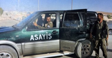 YPG terrorists are seen during a patrol in this undated file photo. (IHA Photo)