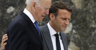 U.S. President Joe Biden (L) and France's President Emmanuel Macron walk along the boardwalk during the G-7 summit in Carbis Bay, Cornwall, Britain, June 11, 2021. (EPA Photo)