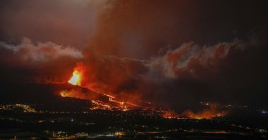 Lava erupts from a volcano near El Paso on the island of La Palma in the Canaries, Spain, Sept. 20, 2021. (Europa Press via AP)