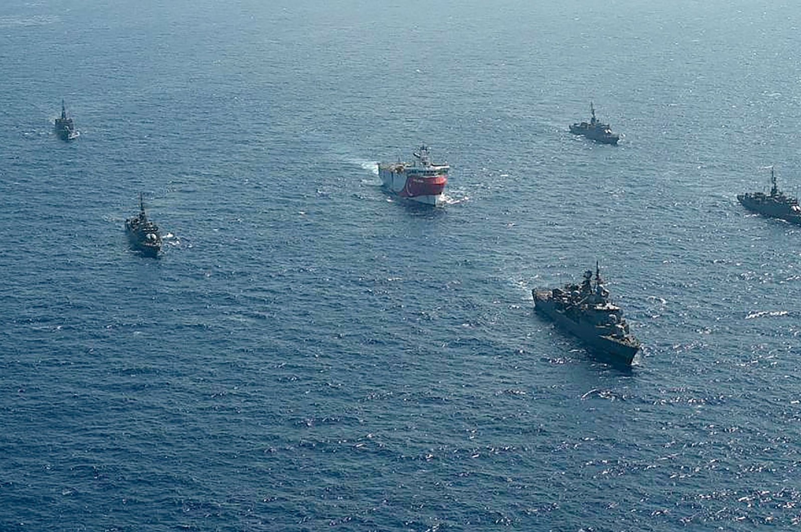 This handout photograph released by the Turkish Defense Ministry shows Turkish seismic research vessel "Oruc Reis" (C) as it is escorted by Turkish Naval ships in the Mediterranean Sea, off Antalya, Aug. 10, 2020. (AFP File Photo)