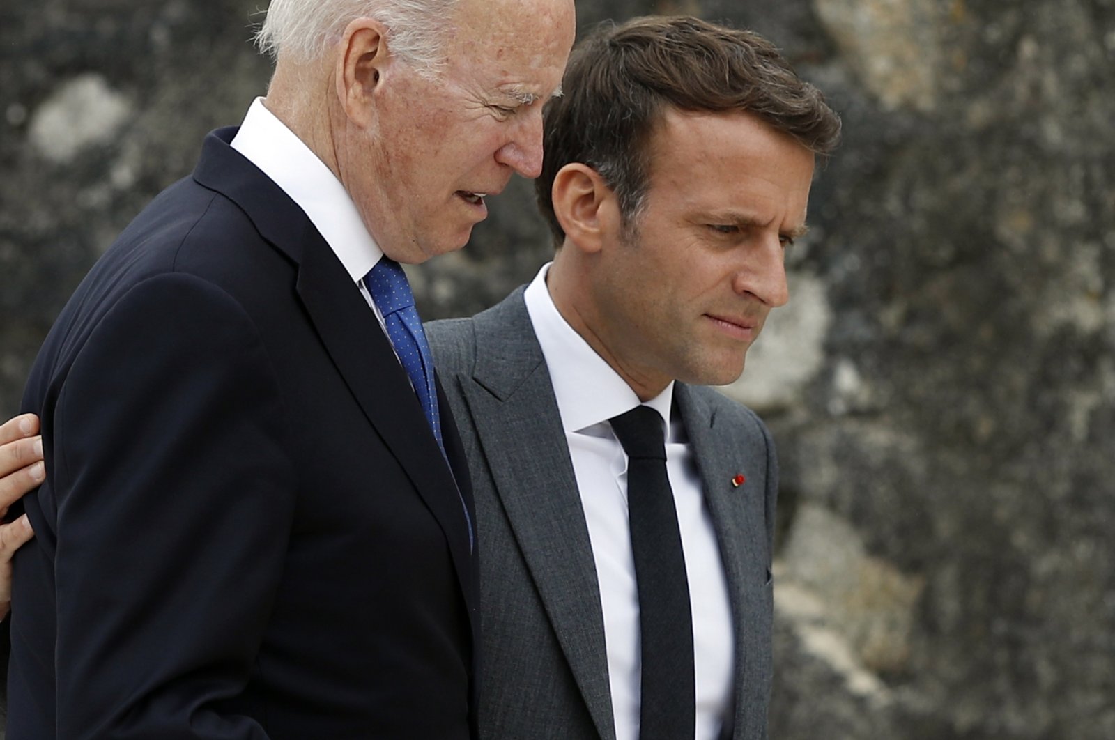 U.S. President Joe Biden (L) and France's President Emmanuel Macron walk along the boardwalk during the G-7 summit in Carbis Bay, Cornwall, Britain, June 11, 2021. (EPA Photo)
