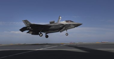 A pilot maneuvers an F-35 jet as military personnel participate in the NATO Steadfast Defender 2021 exercise on the aircraft carrier HMS Queen Elizabeth off the coast of Portugal, May 27, 2021. (AP Photo)