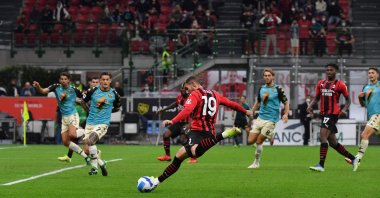 AC Milan's French defender Theo Hernandez (C) shoots to score during a Serie A match against Venezia at the San Siro, Milan, Italy, Sept. 22, 2021. (AFP Photo)