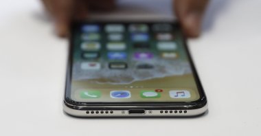 The new iPhone X is displayed in the showroom after the new product announcement at the Steve Jobs Theater on the new Apple campus, in Cupertino, California, U.S., Sept. 12, 2017. (AP Photo)