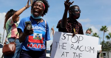 Protesters join together in front of a USCIS building to denounce the expulsion of Haitian refugees from Del Rio, Texas, in Miami, Florida, U.S., Sept. 22, 2021. (AFP Photo)