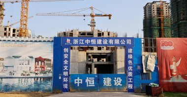 Cranes stand at the construction site of Evergrande Cultural Tourism City, a project developed by China Evergrande Group, in Suzhou's Taicang, Jiangsu province, China, Sept. 23, 2021. (Reuters Photo)