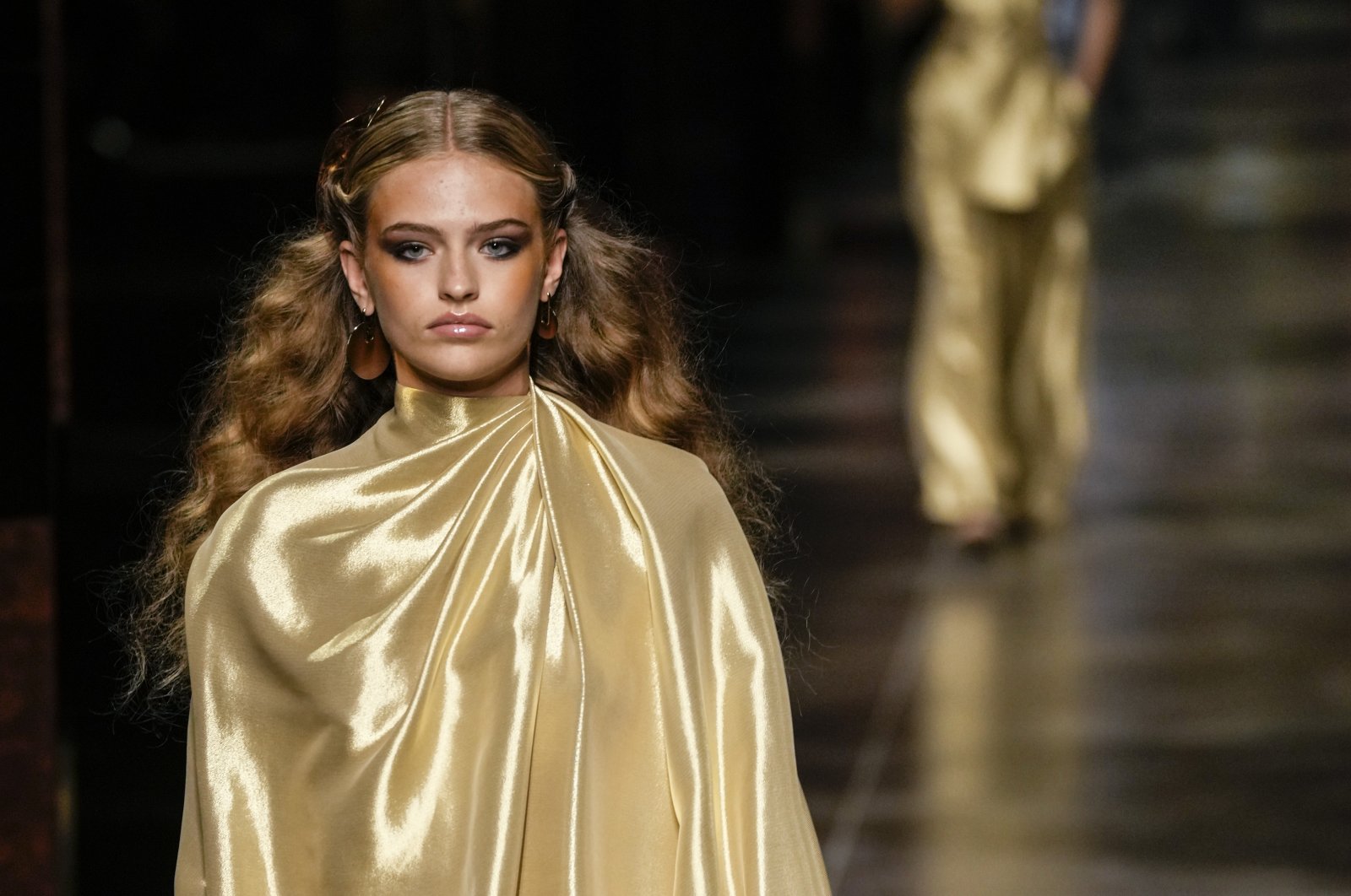 A model wears a creation from the Fendi spring-summer 2022 collection during Milan Fashion Week, in Milan, Italy, Wednesday, Sept. 22, 2021. (AP Photo)