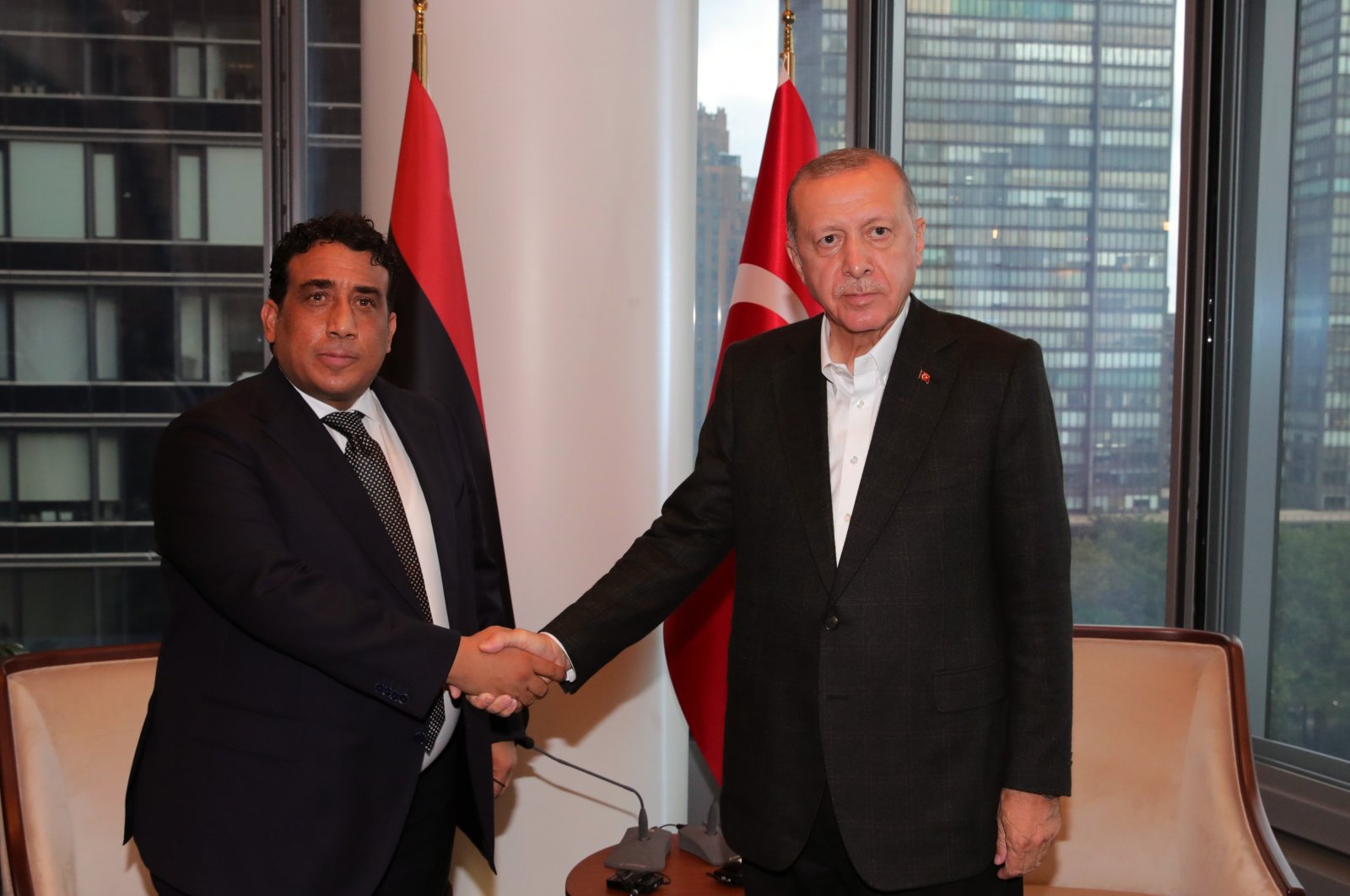 President Recep Tayyip Erdoğan shakes hands with the chairperson of the Presidential Council of Libya, Mohammad Younes Menfi, New York, U.S., Sept. 23, 2021. (IHA Photo)
