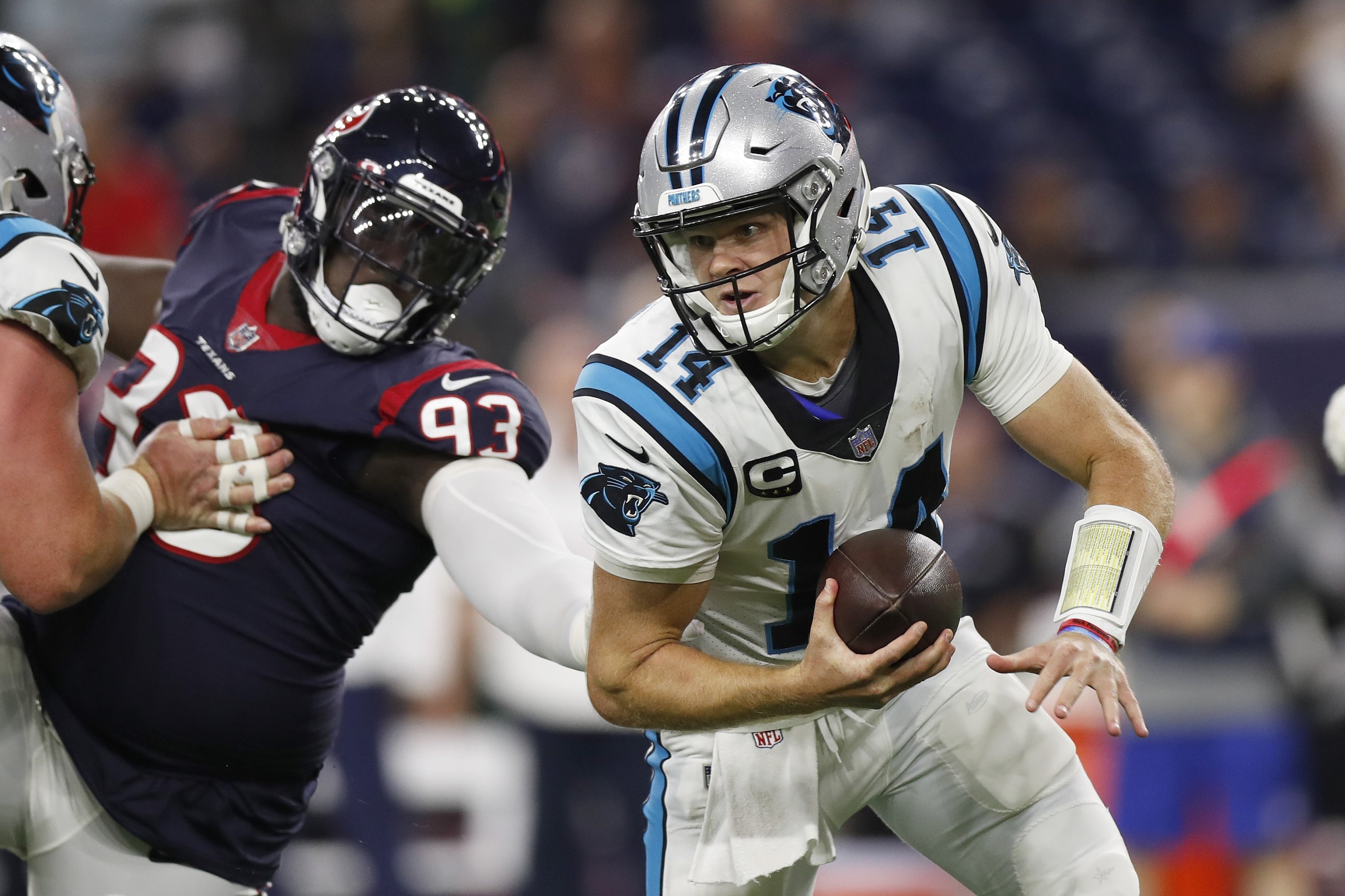 Sam Darnold (14) of the Carolina Panthers tries to escape the tackle of Jaleel Johnson of the Houston Texans during the first half at NRG Stadium, Houston, Texas, U.S., Sept. 23, 2021. (AFP Photo)