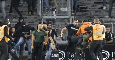 Football supporters clash as angry Marseille supporters invade the field after the Angers-Marseille match, in Angers, France, Sept. 22, 2021. (AP Photo)