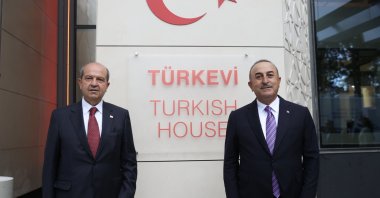 Turkey's Foreign Minister Mevlüt Çavuşoğlu and Turkish Cypriot President Ersin Tatar are seen in front of the Turkish House (Türkevi) in New York, U.S., Sept. 24, 2021. (AA Photo)