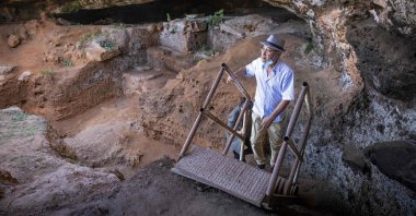 Archeologists walk to enter the Contrebandiers (Smugglers) Cave less than 20 kilometers from the Moroccan capital Rabat, Sept. 18, 2021. (AFP Photo)