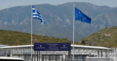The entrance of the new EU-funded multi-purpose RIC ( reception and identification center) of migrants on the island of Samos, Greece, during its inauguration, Sept. 18, 2021. (AFP Photo)