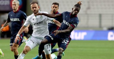 Konyaspor's Sokol Cikalleshi (L) in action against Trabzonspor's Edgar during the match, in Konya, central Turkey, Sept. 23, 2021. (AA PHOTO)