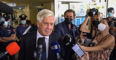 This image grabbed from a video shows the Italian lawyer of exiled former Catalan president Carles Puigdemont, Agostinangelo Marras (L), addressing the media outside the court of appeal of Sassari, Sardinia island, Italy, Sept. 24, 2021. (AFP Photo)