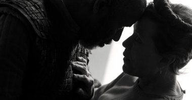 Denzel Washington (L), and Frances McDormand, in a scene from the film “The Tragedy of Macbeth.” (Apple via AP)