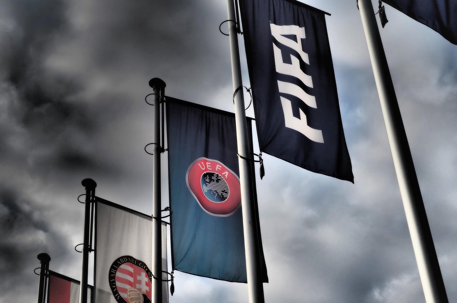FIFA and UEFA flags hang in front of the Hungarian Football Association, in Budapest, Hungary, Oct. 19, 2020. (Shutterstock Photo)