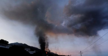Lava and smoke rise at dawn following the eruption of a volcano on the Canary Island of La Palma, in El Paso, Spain, Sept. 25, 2021. (Reuters Photo)