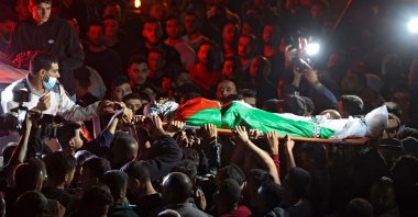 Mourners carry the body of Mohammed Khabisa, a Palestinian who was shot dead by Israeli troops, during his funeral in the village of Beita, the occupied West Bank, Palestine, Sept. 24, 2021. (AFP Photo)