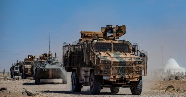 Turkish and Russian military vehicles patrol in the countryside of Rumaylan (Rmeilan) in Syria's northeastern Hasakeh on Sept. 16, 2021. (AFP Photo)