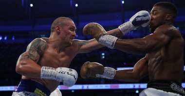 Ukraine's Oleksandr Usyk (L) in action against Britain's Anthony Joshua during their WBA, IBF & WBO heavyweight titles bout at Tottenham Hotspur Stadium, London, England, Sept. 25, 2021. (Reuters Photo)