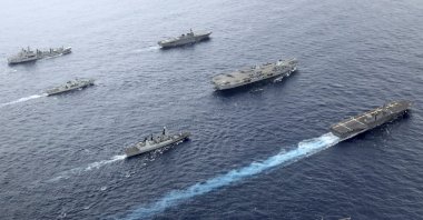 Front to back; HNLMS Evertsen, JS Izumo, HMS Defender, HMS Queen Elizabeth, HMCS Winnipeg, JS Ise, RFA Tidespring. UK Royal Navy Carrier Strike Group 21 HMS Queen Elizabeth, HMS Defender, RFA Tidespring and HNLMS Evertsen from CSG21 sails with Japanese ships JS Izumo and JS Ise along with the Canadian ship HMCS Winnipeg in the Pacific Ocean, Sept. 2021. (UK Ministry of Defence via AP, File Photo))