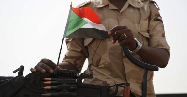 A Sudanese soldier from the Rapid Support Forces or RSF, led by Gen. Mohammed Hamdan Dagalo, stands on his vehicle during a military-backed rally, in the eastern province of the River Nile, Sudan, June 22, 2019. (AP Photo)