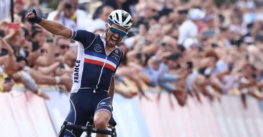 France's Julian Alaphilippe celebrates winning the men's cycling road race, 268.3 kilometers from Antwerp to Leuvenduring the 2021 Road World Championships, Sept. 26, 2021, in Leuven, Belgium. (AFP Photo)