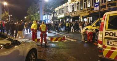 An ambulance takes care of the injured as Norway reopens from the coronavirus restrictions in Trondheim, Norway, Sept. 25, 2021. (Joakim Halvorsen/NTB via AP)